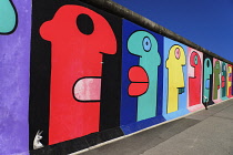 Germany, Berlin, The East Side Gallery, a 1.3  km long section of the Berlin Wall, Mural called Homage to the Young Generation by Thierry Noir.