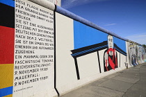 Germany, Berlin, The East Side Gallery, a 1.3  km long section of the Berlin Wall, A mural by Georg Lutz depicts former Soviet leader Mikhail Gorbachev driving.