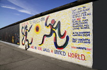 Germany, Berlin, The East Side Gallery, a 1.3  km long section of the Berlin Wall, Mural by Jolly Kunjappu called 'Dancing to Freedom'.