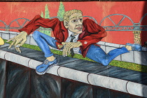 Germany, Berlin, The East Side Gallery, a 1.3  km long section of the Berlin Wall,  'The Wall Jumper' by Gabriel Heimler.