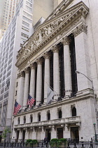 USA, New York, Manhattan, Wall Street Stock Exchange, the facade with American flags attached.