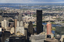 USA, New York,  Manhattan, View from Empire State building over midtown skyscrapers and East River towards Queens and Long Island with Art Deco Chrysler Building prominent.