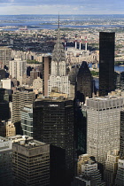 USA, New York,  Manhattan, View from Empire State building over midtown skyscrapers and East River towards Queens and Long Island with Art Deco Chrysler Building prominent.