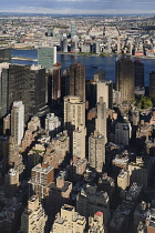 USA, New York,  Manhattan, View from Empire State building over midtown skyscrapers and East River towards Queens and Long Island with Art Deco Chrysler Building prominent.