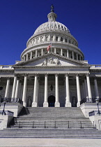 USA, Washington DC, Capitol Building, Head on view of the central section with its dome and American flag at half mast.