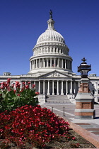 USA, Washington DC, Capitol Building, Head on view of the central section with its dome and flowerbed in the foreground.