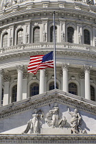USA, Washington DC, Capitol Building, Section of the building's dome with the American flag at half mast.