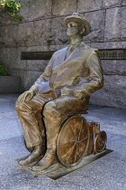 USA, Washington DC, National Mall, President Franklin Delano Roosevelt Memorial, Statue of the former President seatedl in his wheelchair.