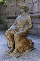 USA, Washington DC, National Mall, President Franklin Delano Roosevelt Memorial, Statue of the former President seatedl in his wheelchair.