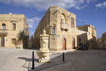 Malta, Gozo, Gharb, old town with stone fountain.