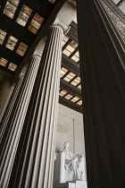USA, Washington DC, National Mall, Lincoln Memorial, Statue of Abraham Lincoln,  Angular view between the pillars of the interior.