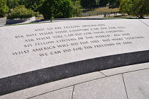 USA, Washington DC, Arlington National Cemetery, Grave of President JF Kennedy with famous quotation on wall.