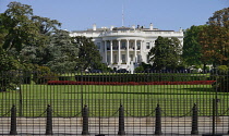 USA, Washington DC, South Portico of the White House with the Stars and Stripes flag flying at half mast.