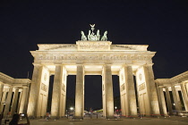 Germany, Berlin, Mitte, Brandenburg Gate in Pariser Platz illuminated at night.