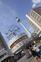 Germany, Berlin, Mitte, Alexanderplatz, the World Clock with Fernsehturm TV Tower behind.