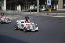 Germany, Berlin, Mitte, Tour of city in minature drag racing cars.