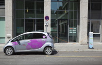 Germany, Berlin, Mitte, Citroen electric car being charged at roadside point.