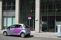 Germany, Berlin, Mitte, Citroen electric car being charged at roadside point.