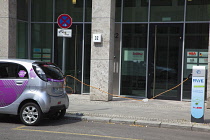 Germany, Berlin, Mitte, Citroen electric car being charged at roadside point.