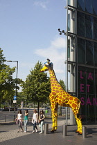 Germany, Berlin, Mitte, Potsdamer Platz, Model of Giraffe outside the Legoland Discovery Centre.