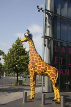 Germany, Berlin, Mitte, Potsdamer Platz, Model of Giraffe outside the Legoland Discovery Centre.