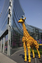 Germany, Berlin, Mitte, Potsdamer Platz, Model of Giraffe outside the Legoland Discovery Centre.