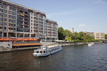 Germany, Berlin, Mitte, Tourist Cruise boats on the River Spree near Friedrichstrasse.