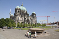 Germany, Berlin, Mitte, Museum Island, Cathedral with Fernsehturm TV Tower behind.