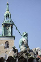 Germany, Berlin, Mitte, Neptunbrunnen fountain next to St Marienkirche in Alexanderplatz.