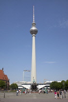 Germany, Berlin, Mitte, Fernsehturm TV Tower seen from St Marienkirche and Neptunbrunnen in Alexanderplatz.