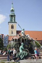Germany, Berlin, Mitte, Neptunbrunnen fountain next to St Marienkirche in Alexanderplatz.