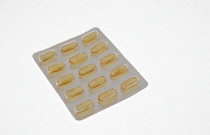 Health, Medicines, Yellow capsules in blister pack.