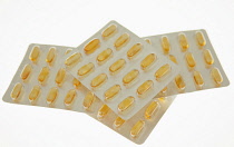 Health, Medicines, Yellow capsules in blister pack.