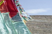 China, Tibet, Close view of the waving colorful prayer flags.