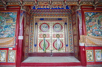 China, Tibet, The door to the temple of Longwu Tibetan monastery.