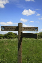 England, West Sussex, Slindon, View of the South Downs with wooden sign for public bridleway.