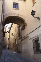 Spain, Castilla La Mancha, Toldeo, Archway on Calle del Angel in the old quarter of the City.