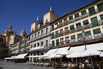 Spain, Castille-Leon, Segovia, Cafes in the Plaza Mayor, with the Cathedral to the left.