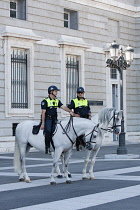 Spain, Madrid, Mounted policemen outside the Palacio Real.
