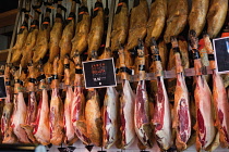 Spain, Madrid, Flanks of Jamon on display.