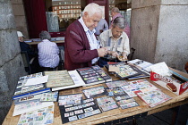 Spain, Madrid, Stamp collectors in the Plaza Mayor.