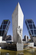 Spain, Madrid, Puerta de Europa with the monument to Calvo Sotelo in the foreground at Plaza de Castilla.