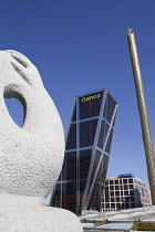 Spain, Madrid, Puerta de Europa with the monument to Calvo Sotelo in the foreground at Plaza de Castilla.