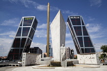 Spain, Madrid, Puerta de Europa with the monument to Calvo Sotelo in the foreground at Plaza de Castilla.