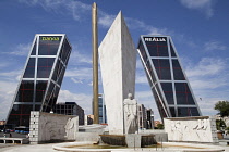 Spain, Madrid, Puerta de Europa with the monument to Calvo Sotelo in the foreground at Plaza de Castilla.