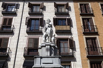 Spain, Madrid, Statue and apartments in the Plaza Mayor district.