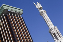 Spain, Madrid, Statue of Christopher Columbus and the Colon Towers at Plaza de Colon.