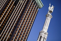 Spain, Madrid, Statue of Christopher Columbus and the Colon Towers at Plaza de Colon.