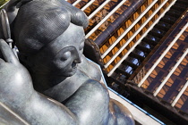 Spain, Madrid, Fernando Botero's statue of a fat lady lying down at Plaza de Colon.