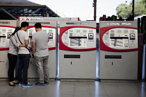 Spain, Madrid, Self-service ticket machines at Principe Pio metro station.